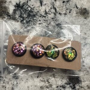 Purple and green stud earrings
